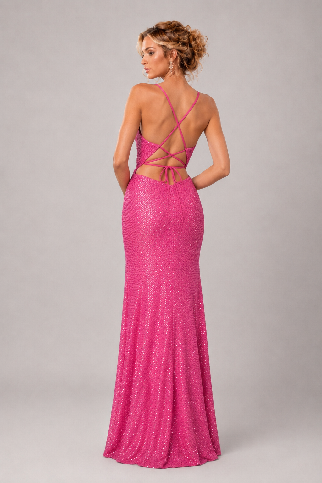 Hot pink sequin V-neck maxi dress with spaghetti straps, ruched waist, and high front slit for prom and formal occasions.