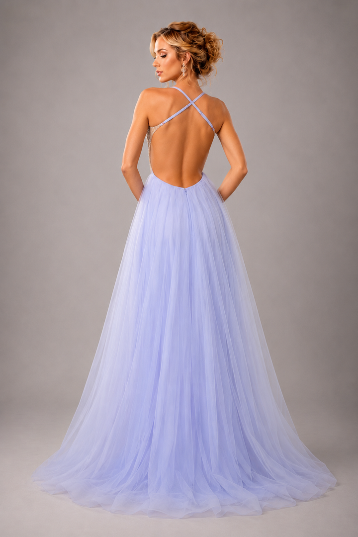 Lavender tulle A-line gown with beaded bodice, spaghetti straps, and high front slit for prom and formal occasions.